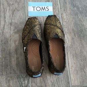 Toms shiny Gold and Black design Sz 7.5